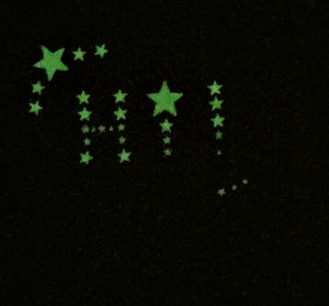 Glowing stars that spell hi.